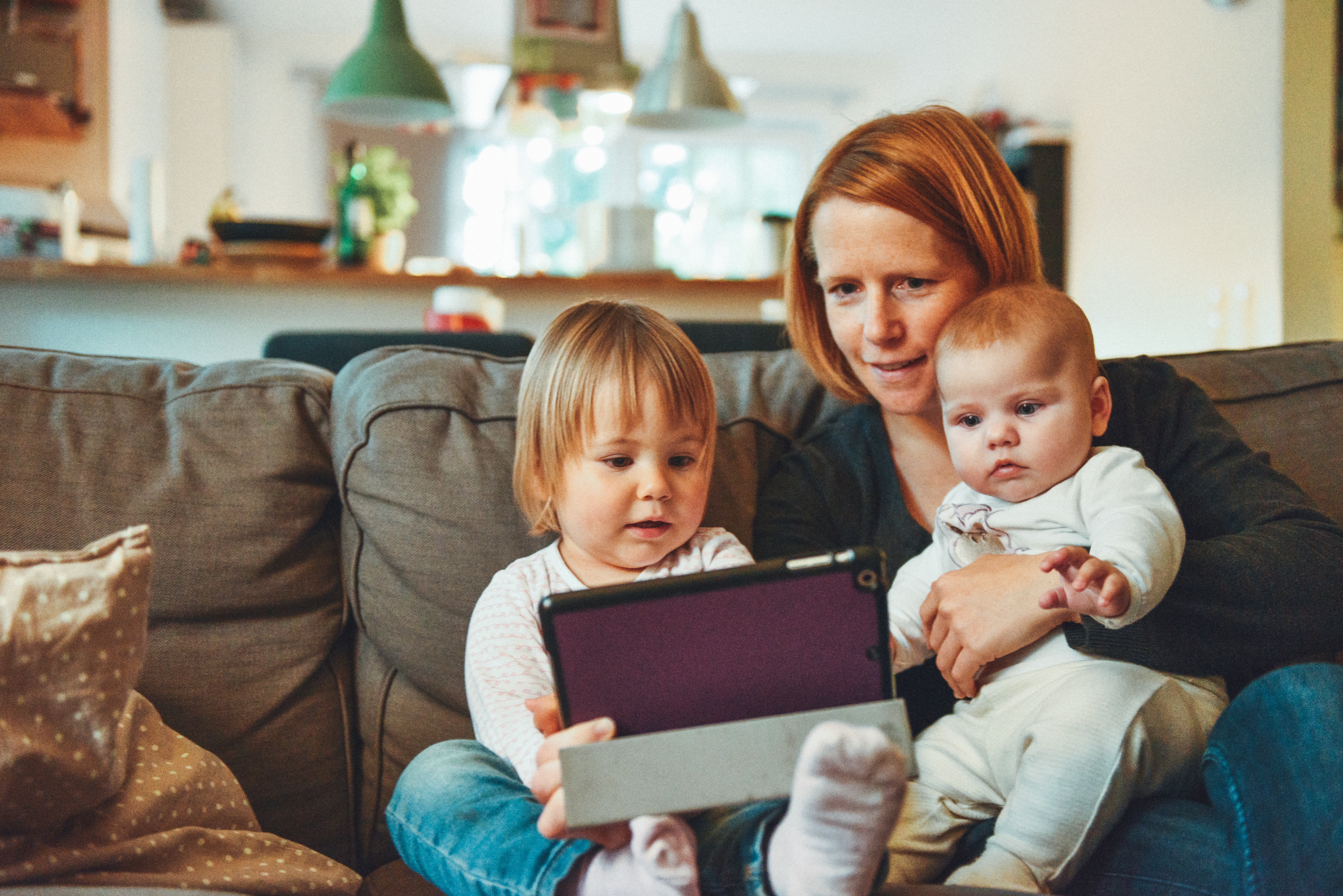mam and babies watching iPad
