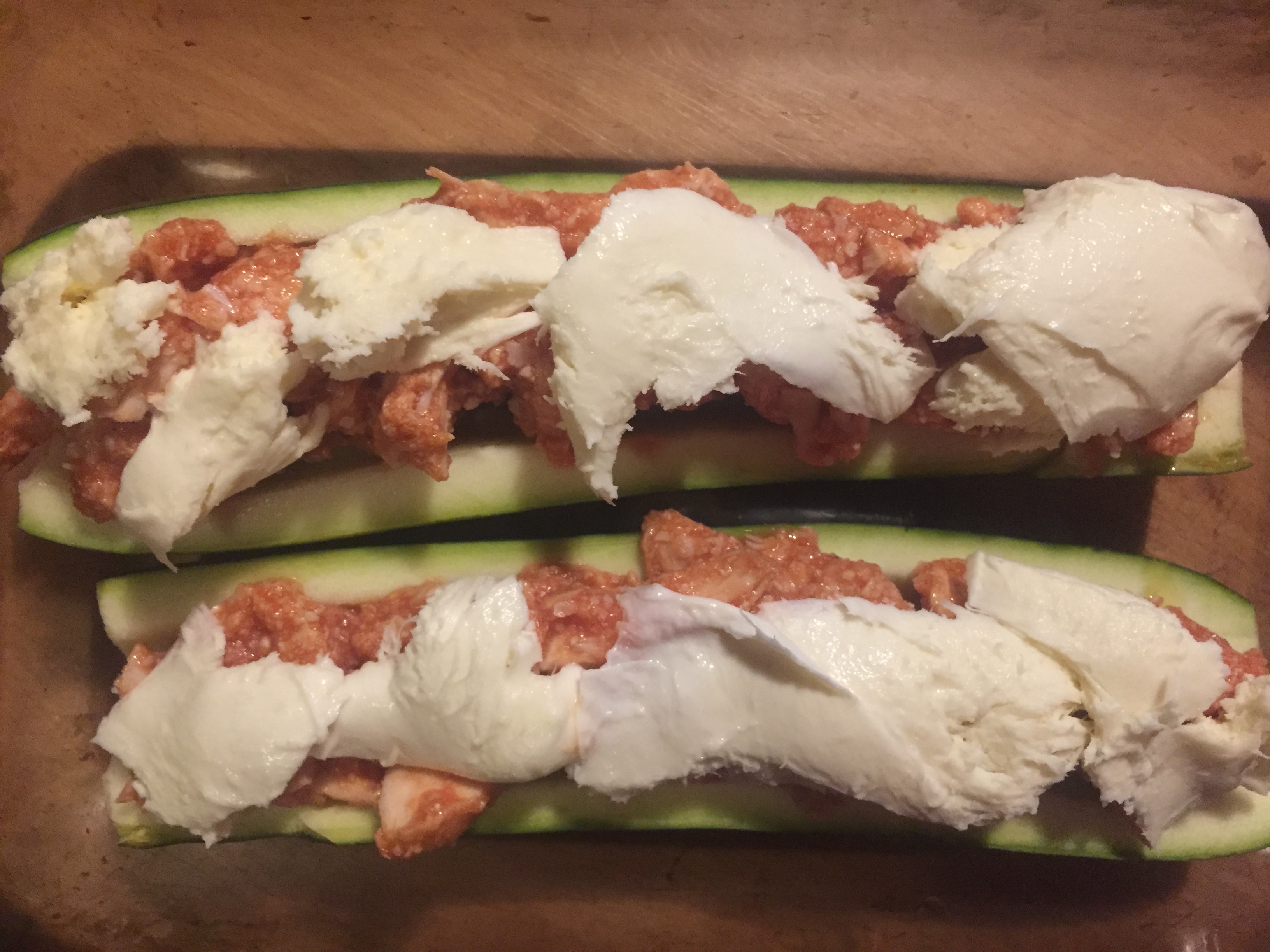 Mozzarella on top of zucchini boats