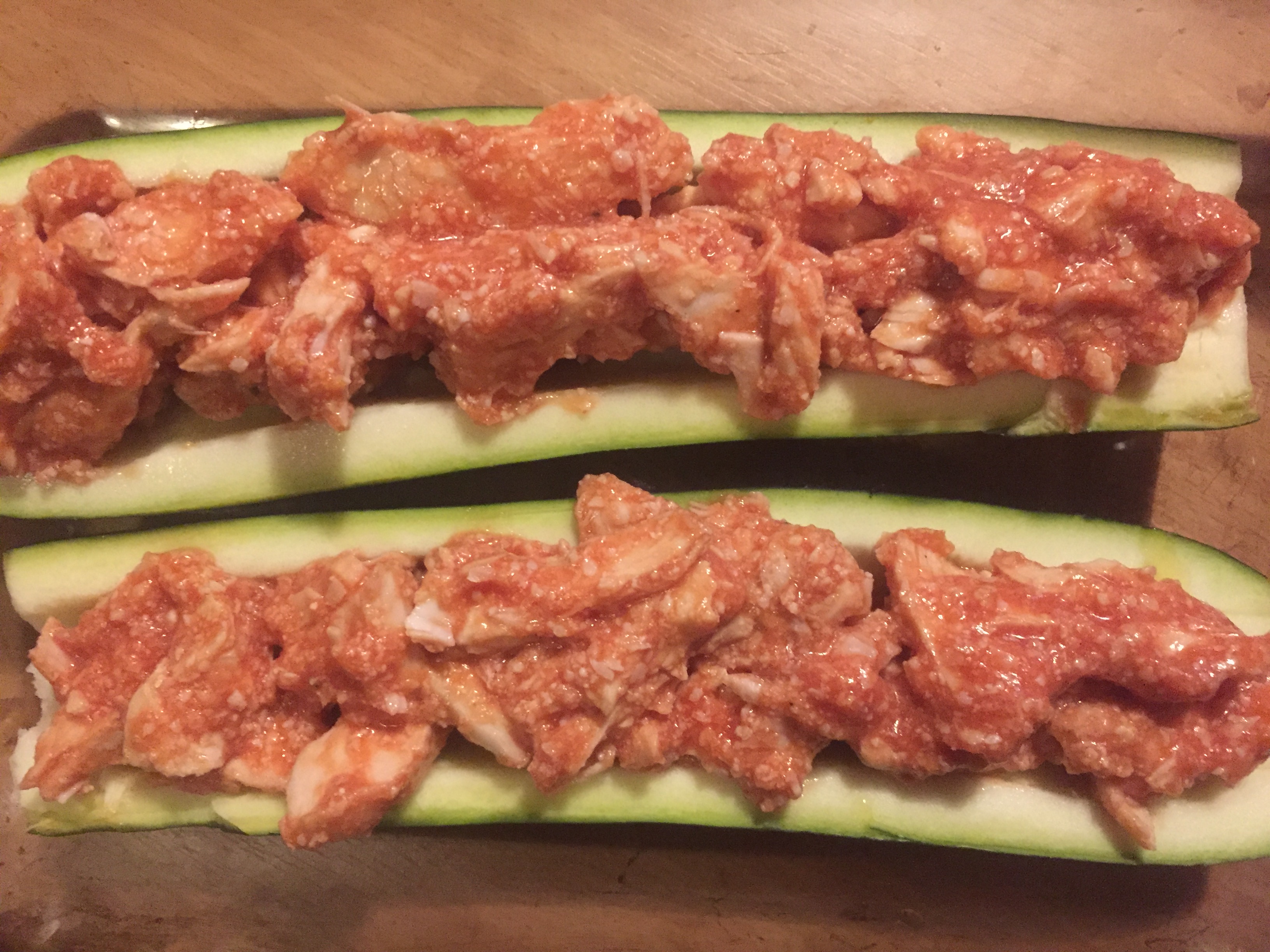 Filled zucchini boats with chicken parmesan mixture