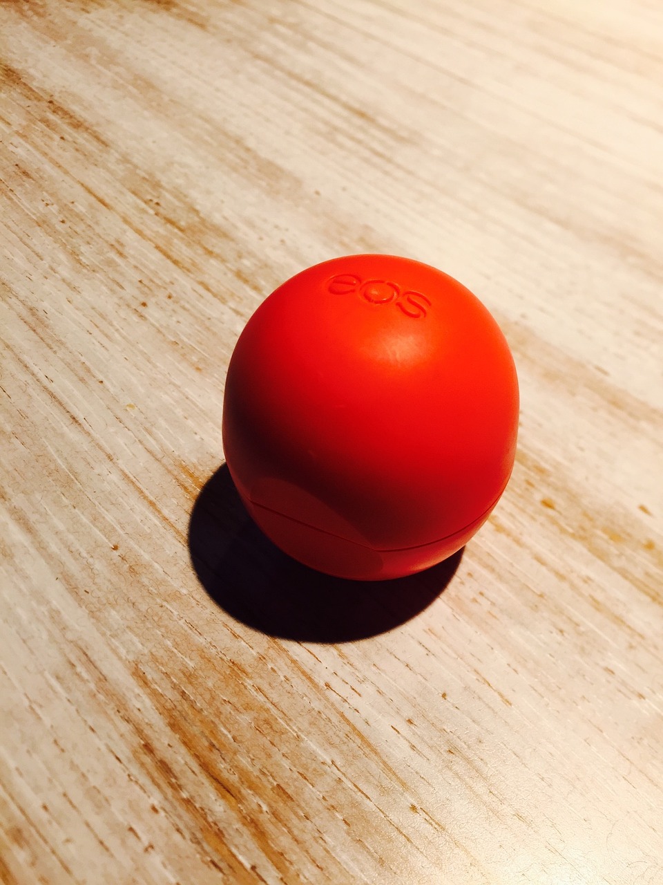 ball shaped Eos lipbalm pot